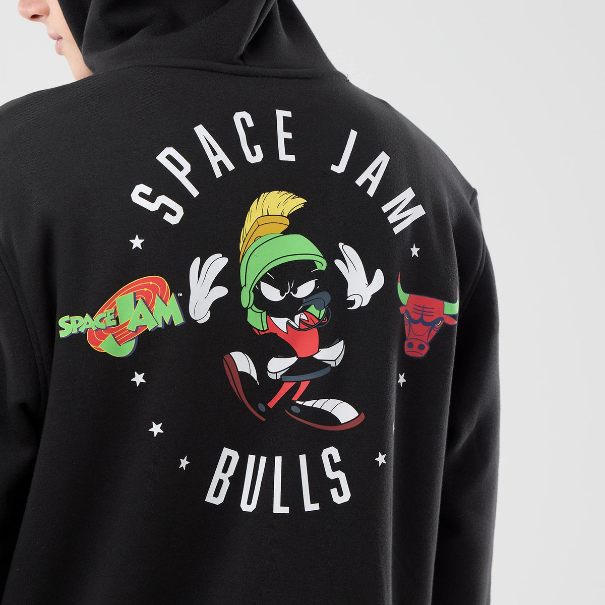 New Era Chicago Bulls Space Jam 2 X NBA Black Pullover Hoodie, back view showing a large graphic of Marvin the Martian in the centre with white Space Jam lettering above and Bulls below, alongside the Space Jam logo and a red Chicago Bulls logo.