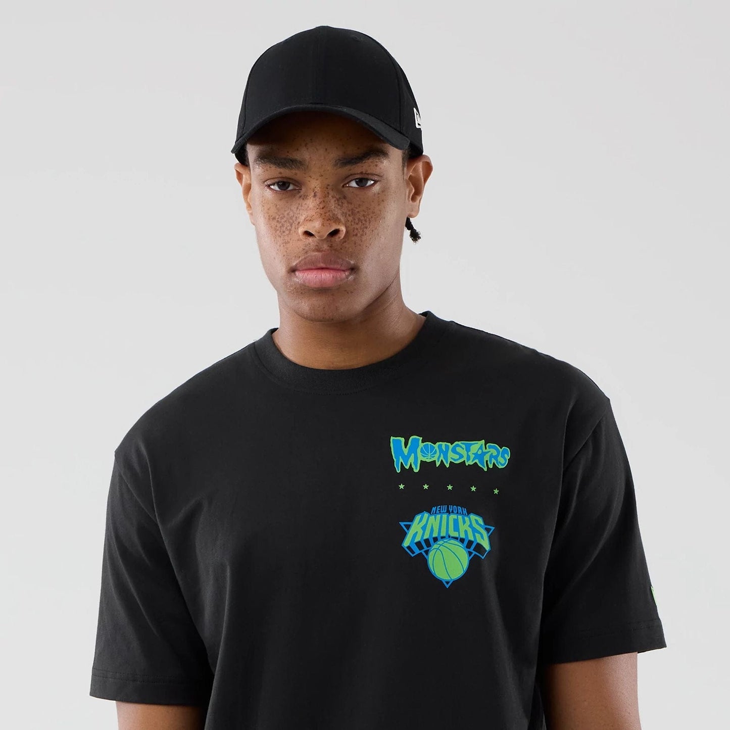 The model is wearing this Space Jam 2 X NBA New York Knicks T-Shirt in black. 7