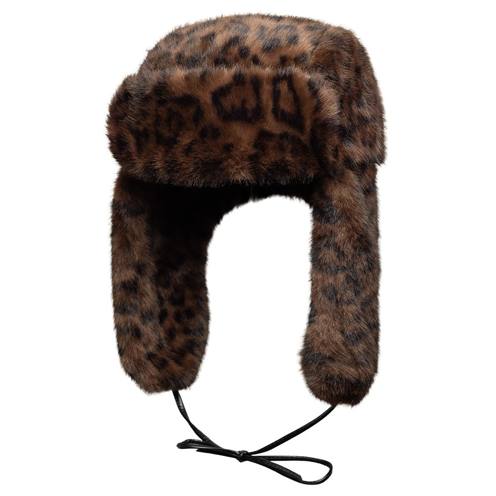 New Era Leopard Brown Trapper Hat, front view showing the faux fur leopard pattern across the crown and ear flaps, with adjustable black chin straps tied in a bow at the bottom.