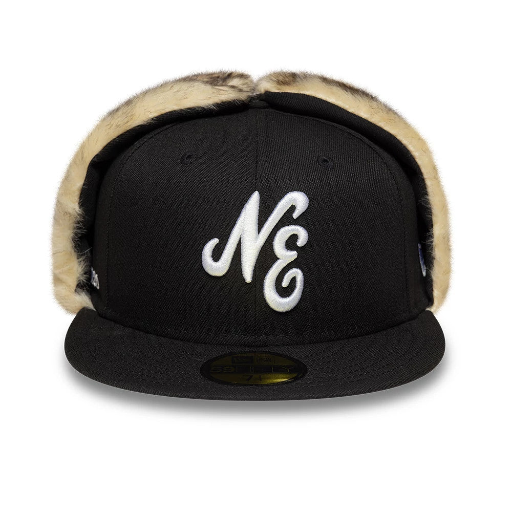 New Era Black Dogear 59FIFTY Fitted Cap, front view showing white NE script embroidery on the black structured crown, with furry side panels and a flat black visor with a gold 59FIFTY size sticker.