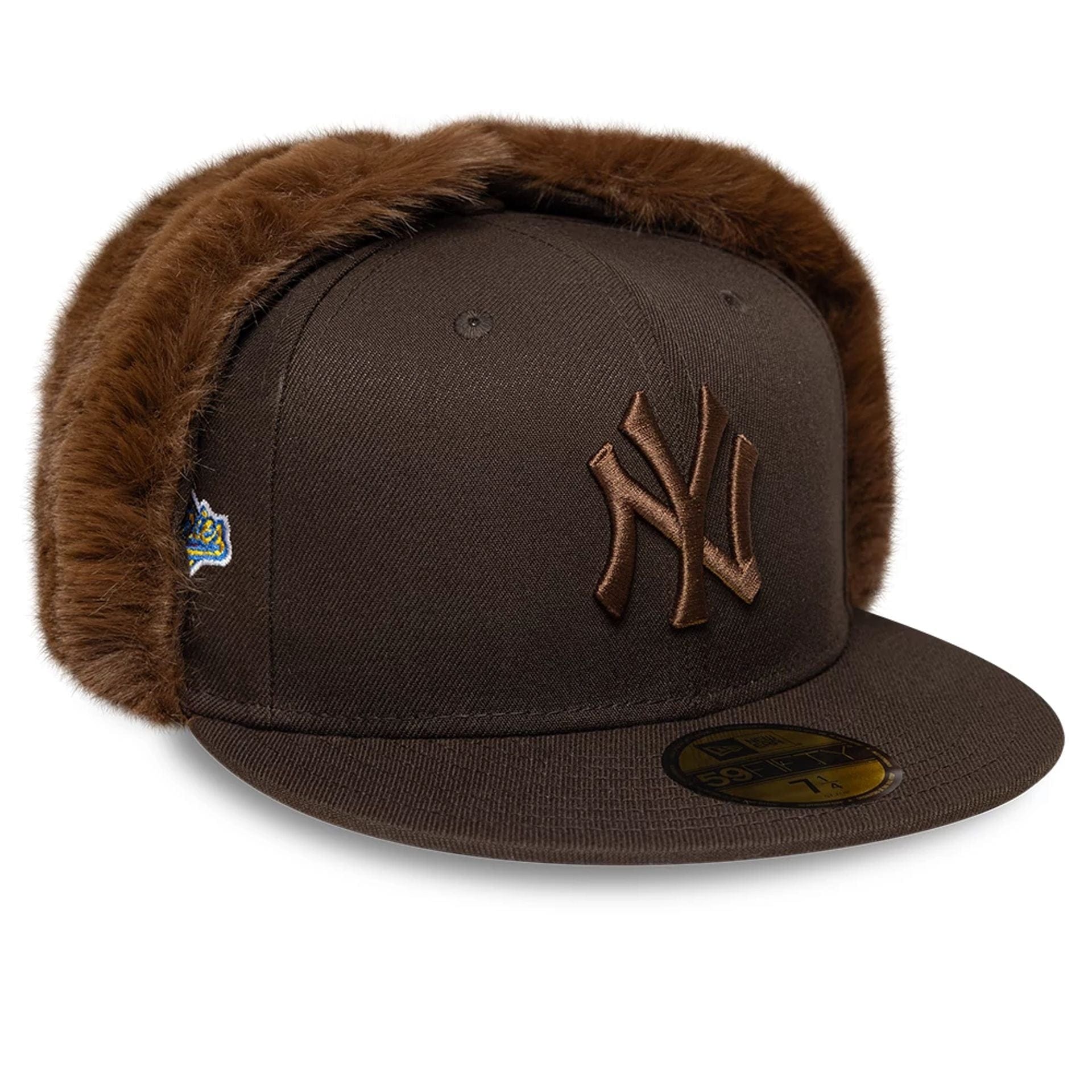 Pictured is this MLB World Series New York Yankees Dogear 59FIFTY Fitted cap in dark brown. 1