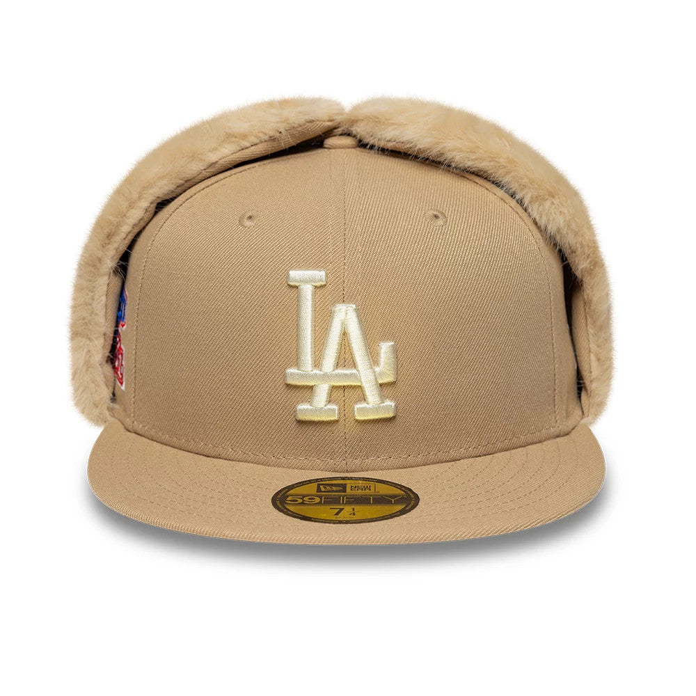 LA Dodgers MLB World Series Light Beige New Era Dogear 59FIFTY Fitted Cap, front view showing the cream embroidered LA logo on the front panel with attached beige faux fur ear covers and a gold 59FIFTY size sticker on the visor.