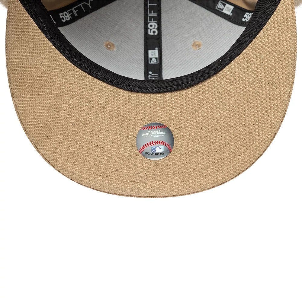 LA Dodgers MLB World Series Light Beige New Era Dogear 59FIFTY Fitted Cap, inside view showing a grey undervisor, black taping with 59FIFTY branding and a Major League Baseball size sticker on the beige fabric.
