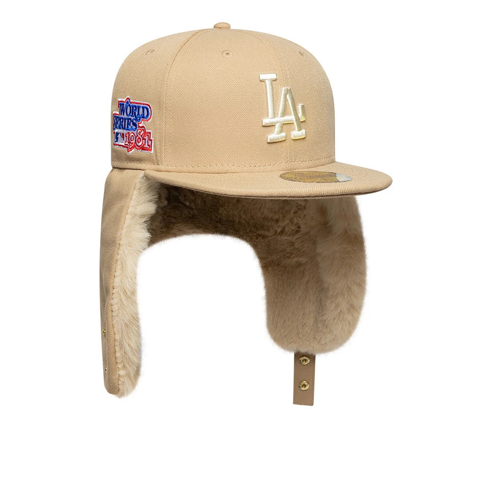 LA Dodgers MLB World Series Light Beige New Era Dogear 59FIFTY Fitted Cap, three-quarter view showing the white LA logo on the front panel, World Series 1961 patch on the side, and a gold 59FIFTY size sticker on the flat visor.