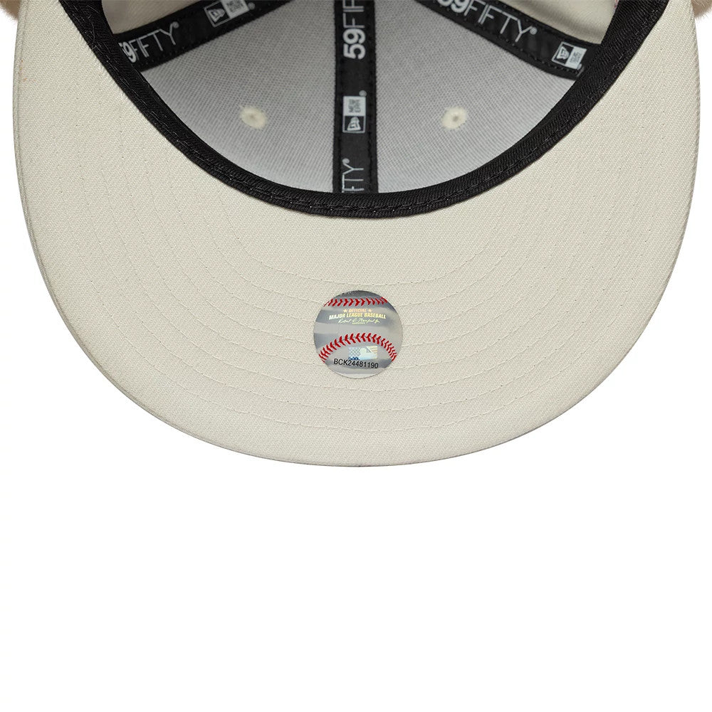 Athletics MLB World Series Cream Dogear New Era 59FIFTY Fitted Cap, inside view featuring black taping with 59FIFTY branding, a black sweatband, cream undervisor, and a central MLB size sticker in red and blue tones.