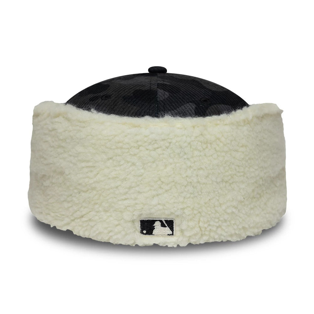 Chicago White Sox MLB Cord Black Downflap New Era 59FIFTY Fitted Cap, rear view showing the embroidered black and white MLB Batterman logo at the centre of the cream downflap, with a black top button on the corduroy crown.