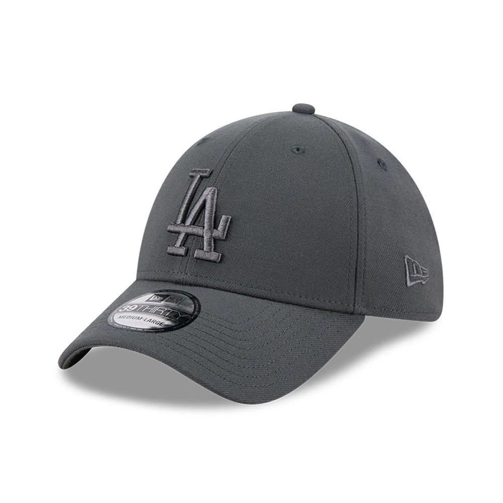 LA Dodgers MLB Steel Charcoal New Era 39THIRTY Stretch Fit Cap, three-quarter view showing the raised grey embroidered LA logo on the front panel, curved visor with 39THIRTY size sticker, and New Era flag logo on the left side.