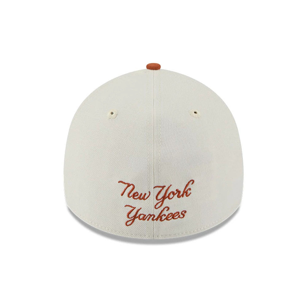 New York Yankees MLB Chrome Burnt Orange Logo New Era 39THIRTY A-Frame Stretch Fit Cap, rear view showing the burnt orange cursive embroidered text reading New York Yankees centred on the cream back panels with eyelets.