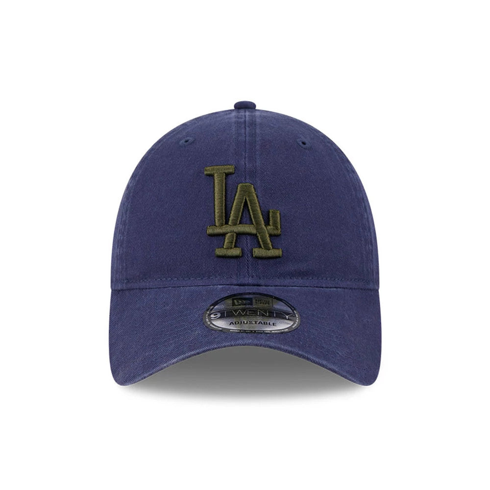 LA Dodgers MLB Rifle Green Logo Navy New Era 9TWENTY Adjustable Cap, front view showing a raised rifle green embroidered LA logo on the navy crown with matching eyelets and a curved visor, featuring a 9TWENTY size sticker.