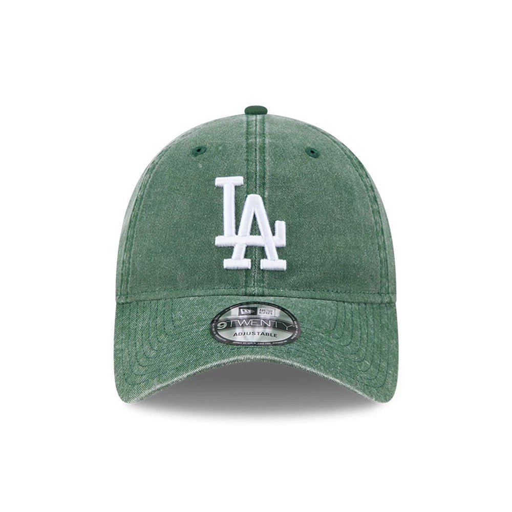 LA Dodgers MLB Overwash Dark Green New Era 9TWENTY Adjustable Cap, front view showing the white raised embroidered LA logo on the unstructured washed dark green crown with a curved visor and 9TWENTY size sticker.