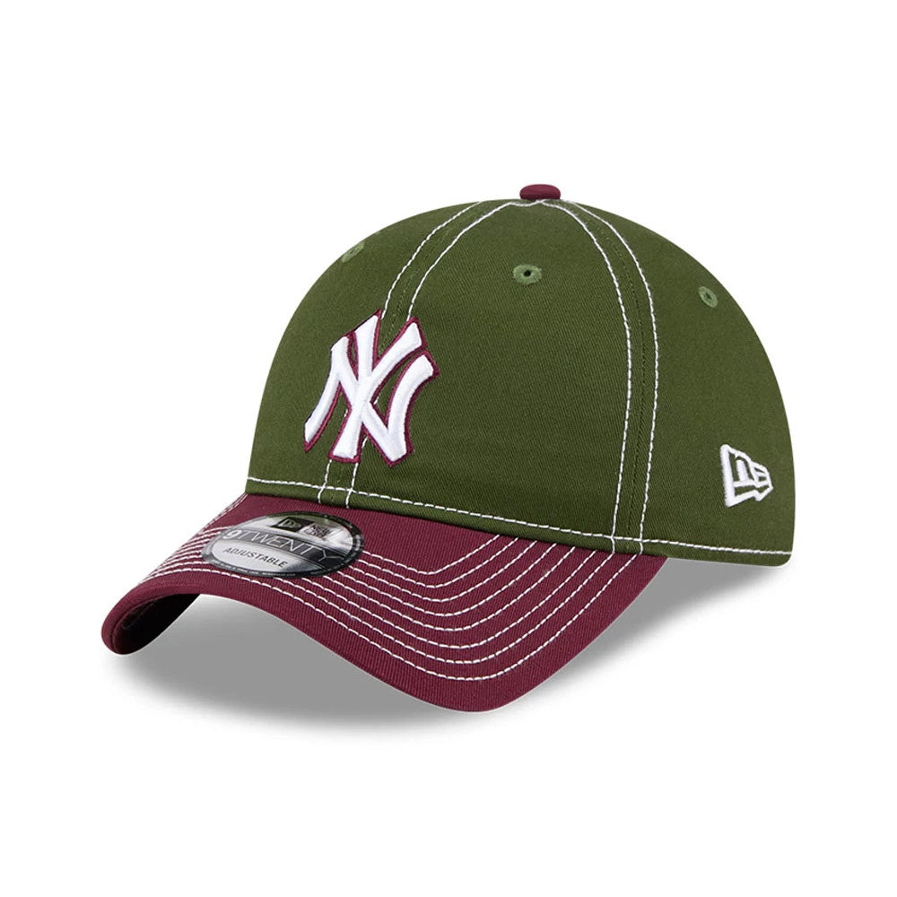 New York Yankees MLB 2Tone Dark Green New Era 9TWENTY Adjustable Cap, three-quarter view showing a white embroidered NY logo on the structured dark green front panel, with a burgundy visor and 9TWENTY size sticker.