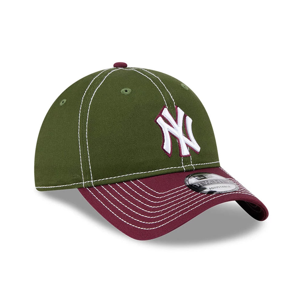 New York Yankees MLB 2Tone Dark Green New Era 9TWENTY Adjustable Cap, three-quarter view showing the white and burgundy embroidered NY logo on the front panel, maroon visor with contrasting white stitching, and 9TWENTY size sticker on the visor.
