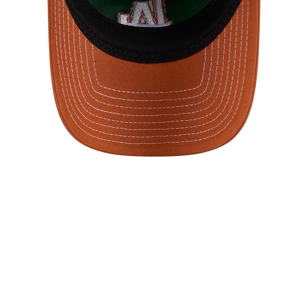 LA Dodgers MLB 2Tone Dark Green New Era 9TWENTY Adjustable Cap, inside view showing a dark undervisor and embroidered LA logo on a green background with contrasting stitching along the orange visor.