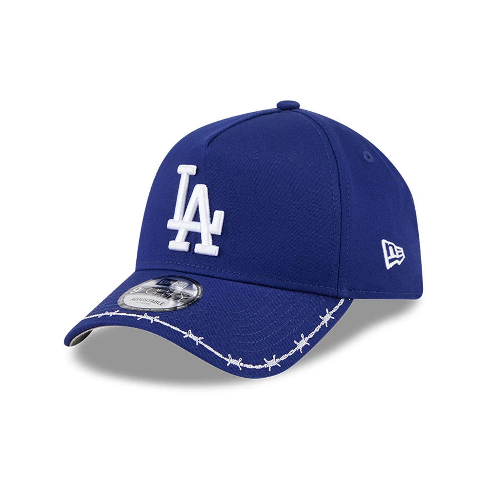 LA Dodgers MLB Barb Visor Dark Blue New Era 9FORTY A-Frame Adjustable Cap, three-quarter view showing the white raised LA logo on the front panel, barbed wire embroidery on the visor, and New Era flag logo on the left side.