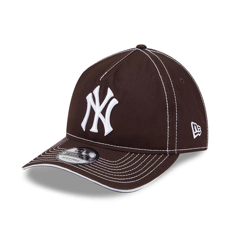 New York Yankees MLB Contrast Dark Brown New Era 9TWENTY A-Frame Adjustable Cap, three-quarter view showing the white NY logo on the front panel, dark brown visor with contrasting white stitching, and the New Era flag logo on the left side.