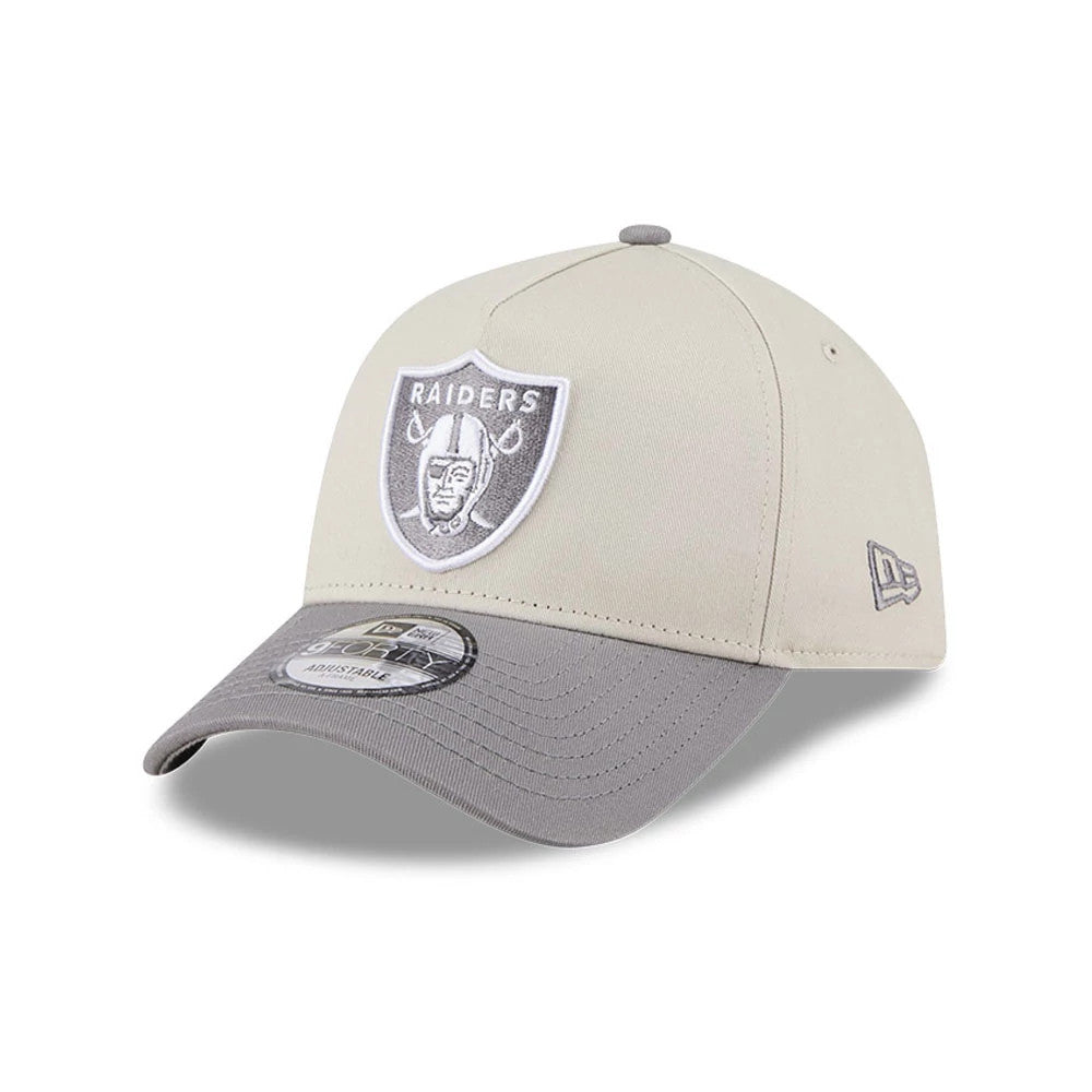 Las Vegas Raiders NFL Stone Storm Light Beige New Era 9FORTY A-Frame Adjustable Cap, three-quarter view showing the white and grey embroidered Raiders logo on the front panel, grey curved visor and 9FORTY size sticker.