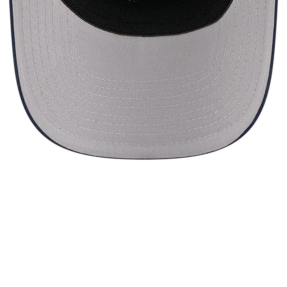 New Era Flawless Dark Blue 9SEVENTY Stretch Snap Adjustable Cap, underside view showing a contrasting light grey undervisor with detailed stitching and a black sweatband lining the interior edge.