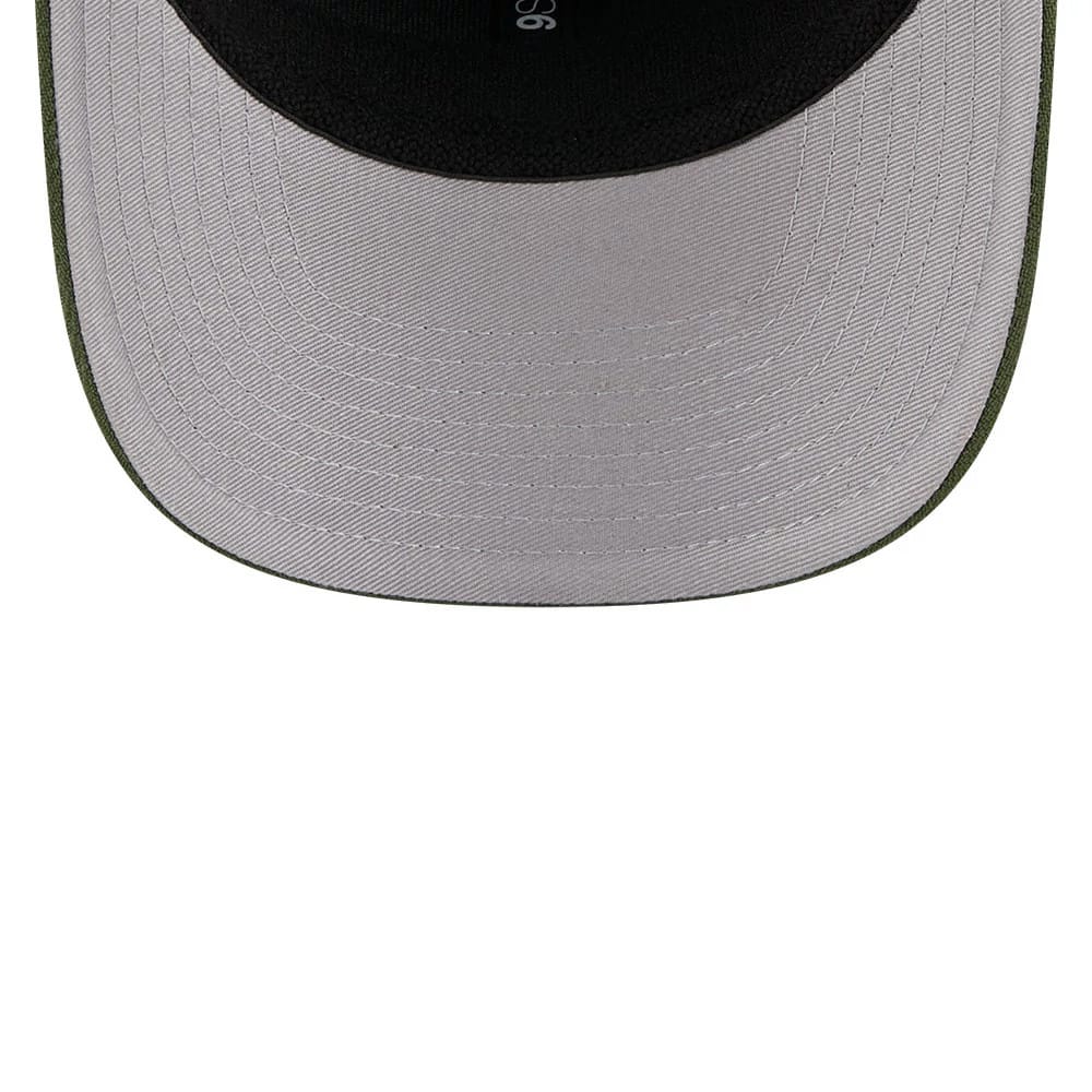 Pictured is this New Era Flawless 9SEVENTY Stretch Snap cap in dark green. 2
