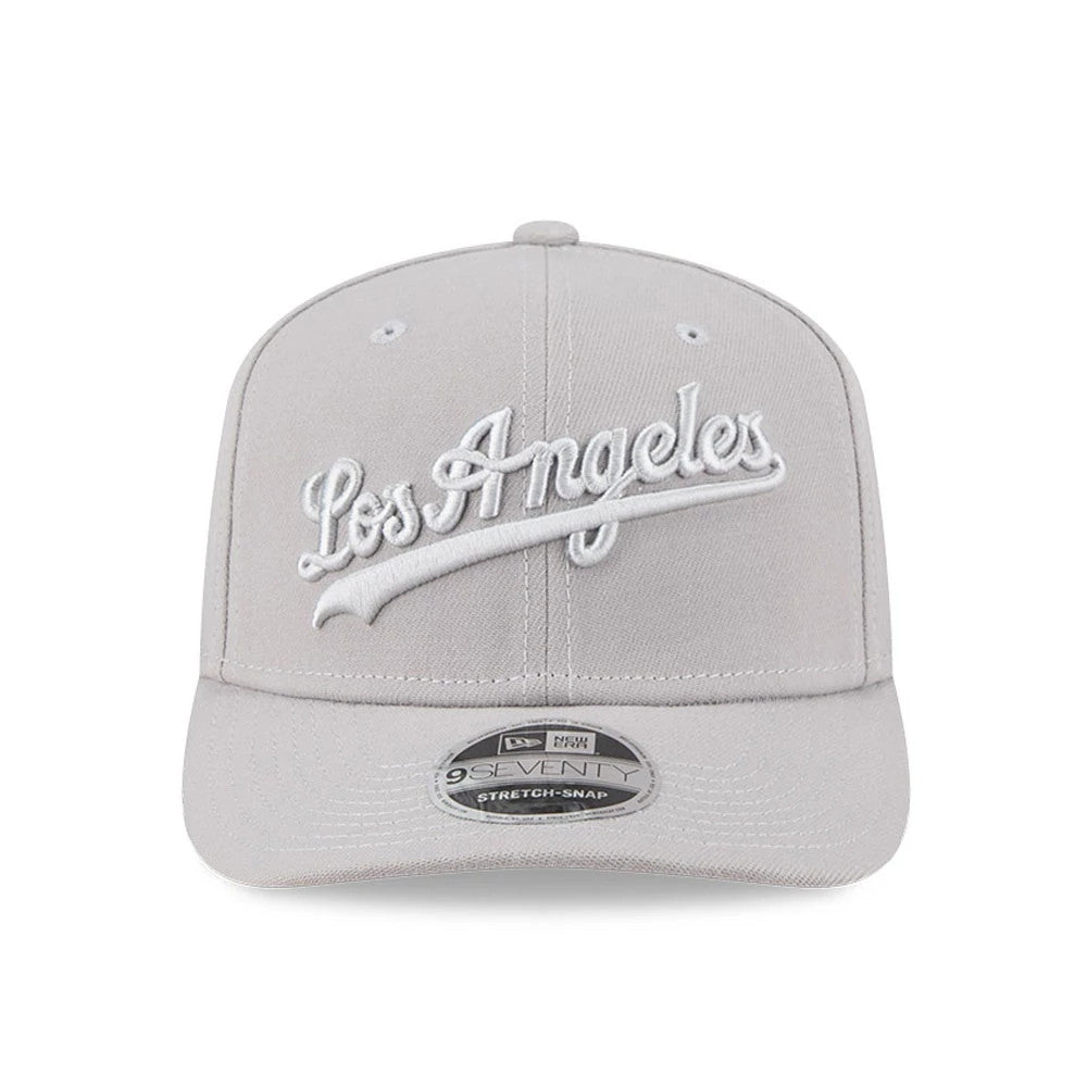 LA Dodgers MLB Script Grey New Era 9SEVENTY Stretch Snap Adjustable Cap, front view showing white raised Los Angeles script embroidery on the grey crown, with a grey visor and a 9SEVENTY size sticker on the visor.