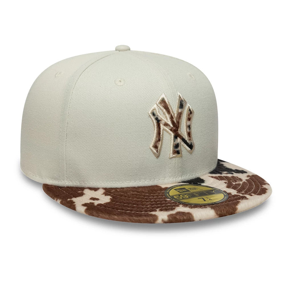 New York Yankees Animal Print Beige New Era 59FIFTY Fitted Cap, front view showing the animal print embroidery on the NY logo and brown patterned flat visor with a gold 59FIFTY size sticker.