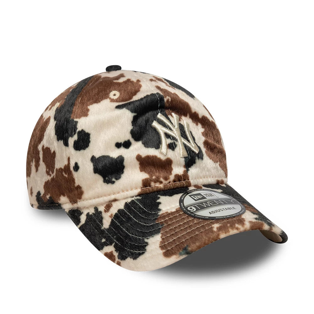 New York Yankees Animal Print Beige New Era 9TWENTY Adjustable Cap, three-quarter view showing the raised cream embroidered NY logo on the animal print crown with a curved visor and the 9TWENTY size sticker on top.
