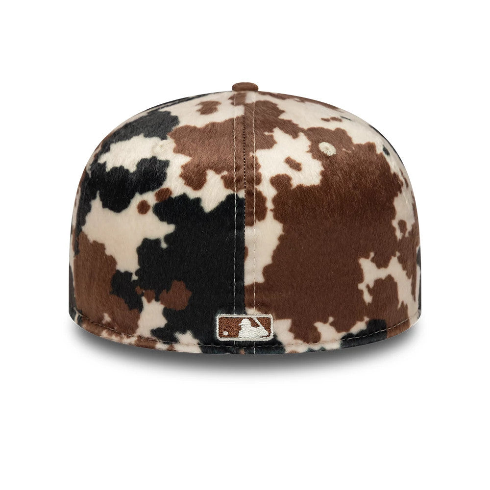 New York Yankees Animal Print Cow Beige New Era 59FIFTY Fitted Cap, rear view showing the embroidered MLB Batterman logo at the centre of the back panels, featuring a brown, black and cream cow print design.