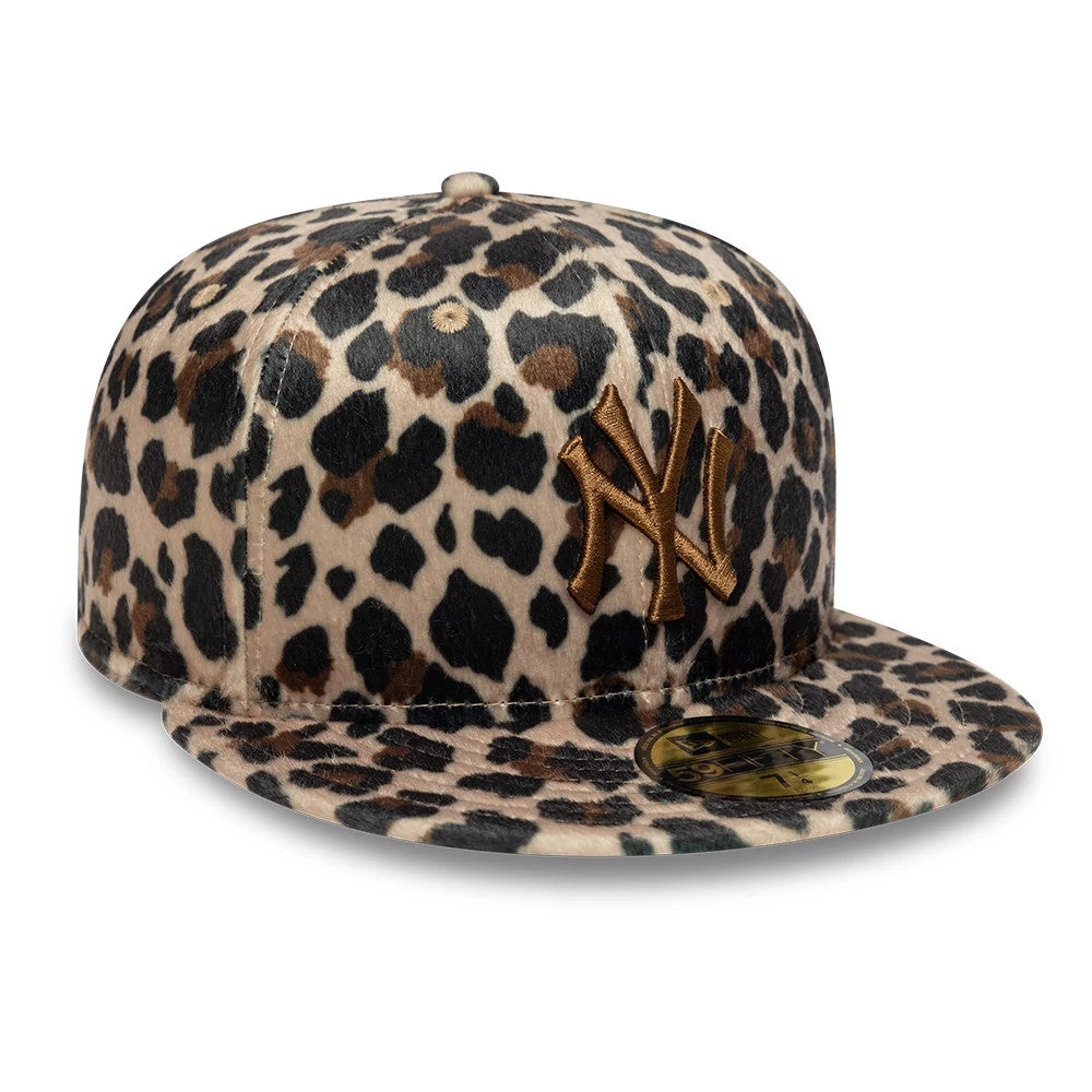 New York Yankees Animal Print Leopard Black New Era 59FIFTY Fitted Cap, three-quarter view with a gold NY logo in raised embroidery on the front panel, leopard print pattern covering the structured crown and flat visor.