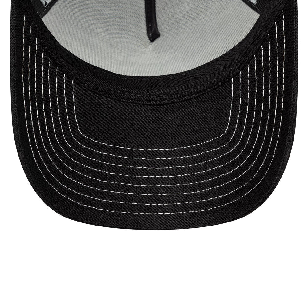 Paris Saint-Germain Black New Era 9FORTY E-Frame Trucker Adjustable Cap, inside view showing a grey undervisor with black sweatband and white contrast stitching details across the black visor.