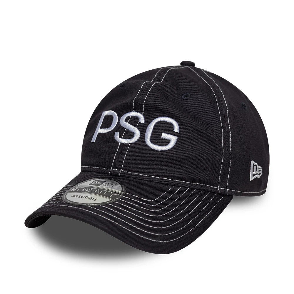 Paris Saint-Germain Pop Stitch Navy New Era 9TWENTY Adjustable Cap, three-quarter view showing the raised white PSG embroidery on the front panel, with contrasting white stitching on the navy visor and a 9TWENTY size sticker.