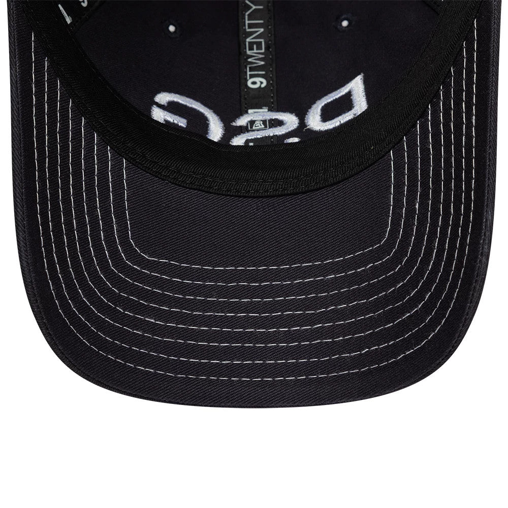 Paris Saint-Germain Pop Stitch Navy New Era 9TWENTY Adjustable Cap, inside view showing the black undervisor with white stitching, 9TWENTY taping in the centre, and partially Paris Saint-Germain lettering.