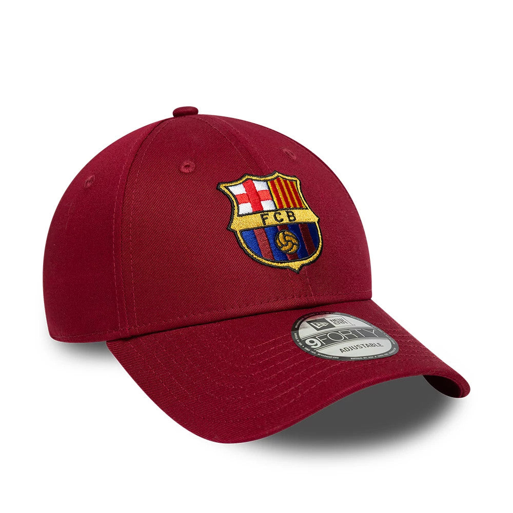 FC Barcelona Core Dark Red New Era 9FORTY Adjustable Cap, three-quarter view showing the raised embroidered FC Barcelona crest on the front panel, dark red curved visor, and a 9FORTY size sticker on top.