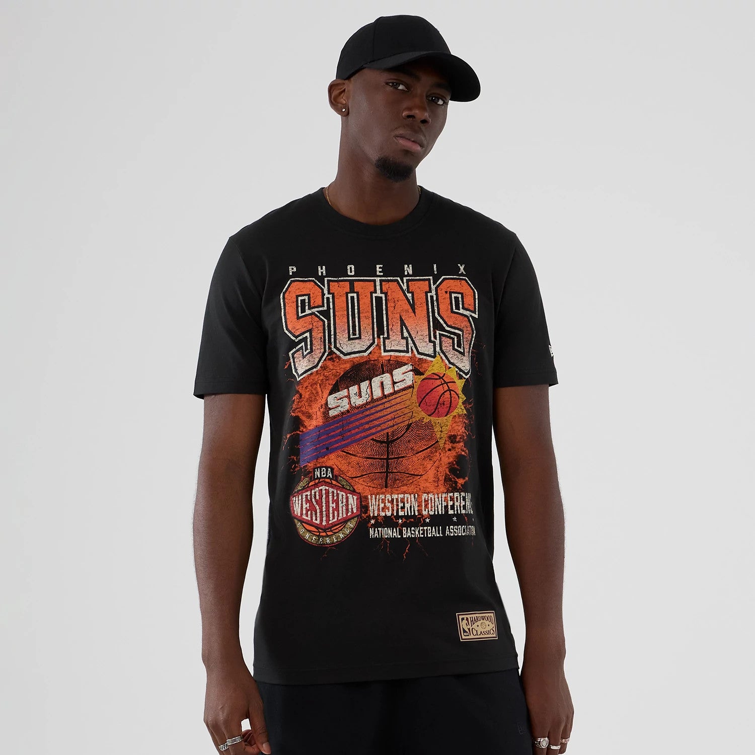 The model is wearing this NBA Hardwood Classic Phoenix Suns T-Shirt in black. 1