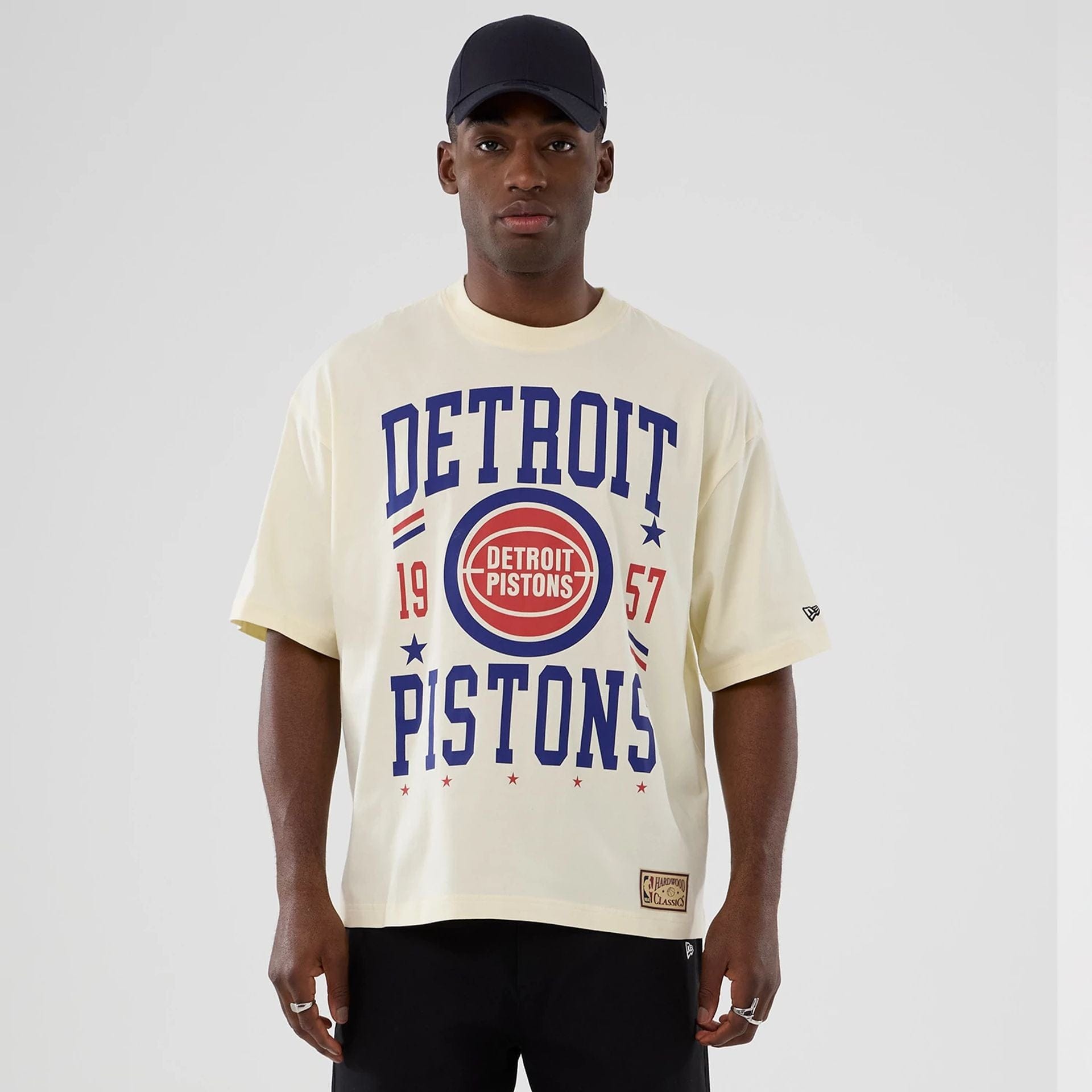 The model is wearing this NBA Hardwood Classic Detroit Pistons T-Shirt in cream. 1