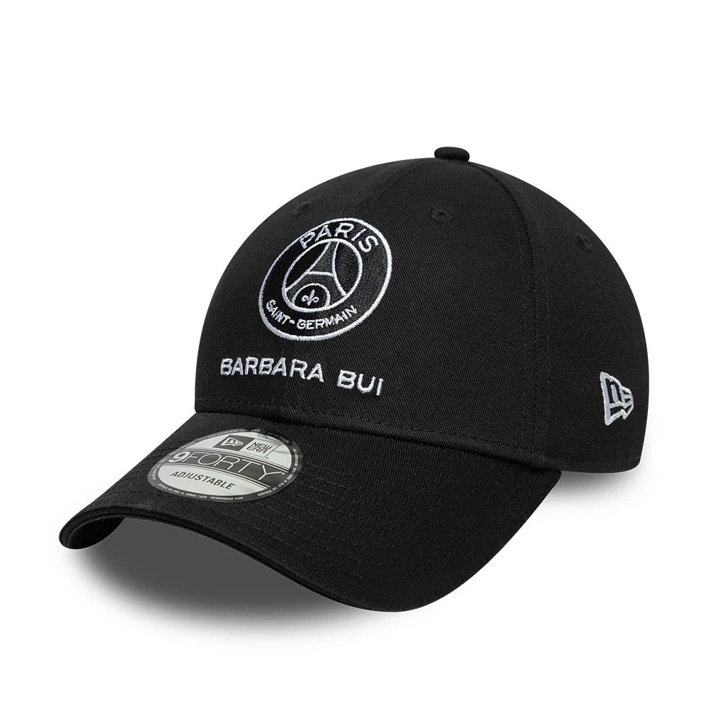 Barbara Bui x Paris Saint-Germain Black New Era 9FORTY Adjustable Cap, three-quarter view showing the white Paris Saint-Germain and Barbara Bui embroidery on the front panel, curved black visor with a 9FORTY size sticker.