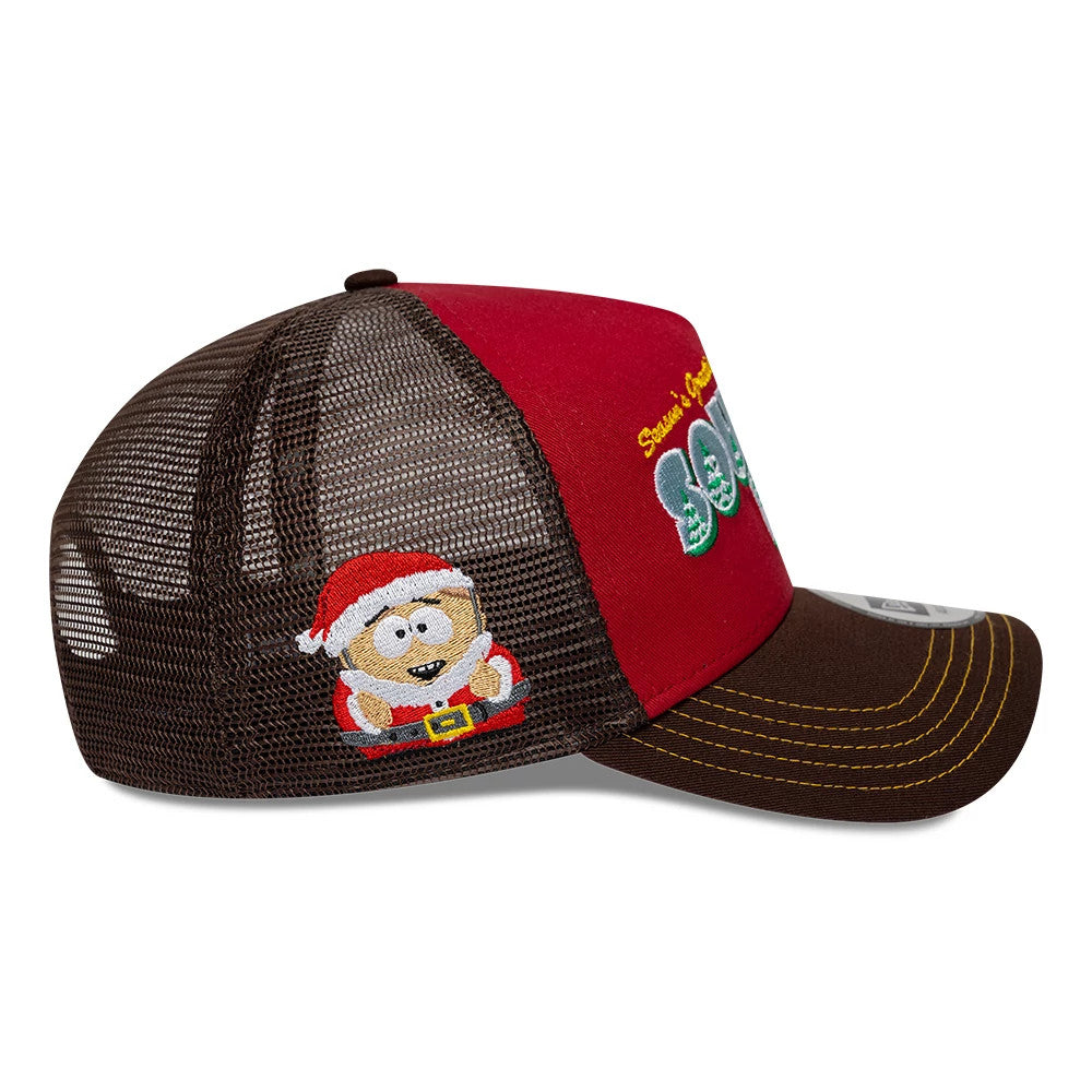 South Park Dark Red New Era 9FORTY A-Frame Trucker Adjustable Cap, side view showing a festive Cartman character embroidered on the brown mesh panel, red structured front panels with an embroidered logo, and a brown curved visor.