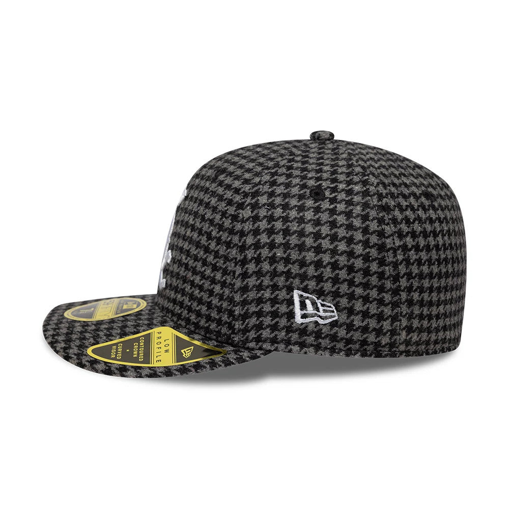 Chicago White Sox MLB Houndstooth Black Low Profile New Era 59FIFTY Fitted Cap, side view showing the white New Era flag logo on the left side, with a houndstooth patterned crown and a flat visor featuring a gold size sticker.