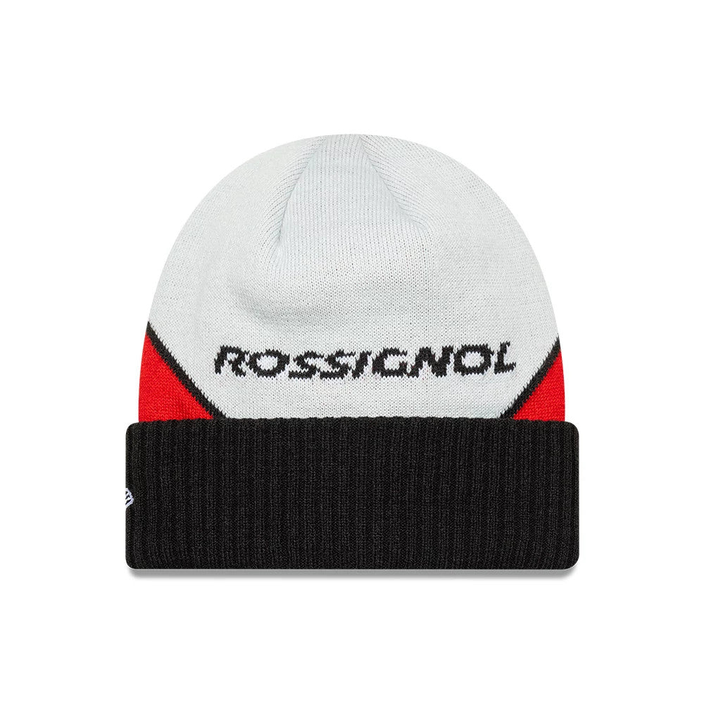 New Era Rossignol x AC Milan Black Cuff Knit Beanie Hat, front view showing the embroidered Rossignol logo on the red and grey patterned crown above a wide black ribbed cuff with New Era flag logo on the side.