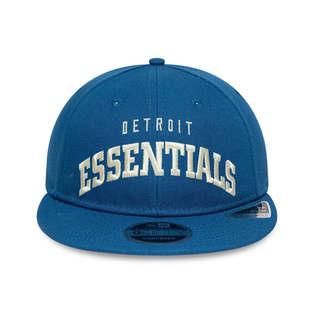 Detroit Lions Fear Of God x NFL Blue Retro Crown New Era 9FIFTY Adjustable Cap, front view showing white raised Detroit Essentials embroidery on the structured blue crown with a black 9FIFTY size sticker on the blue flat visor.
