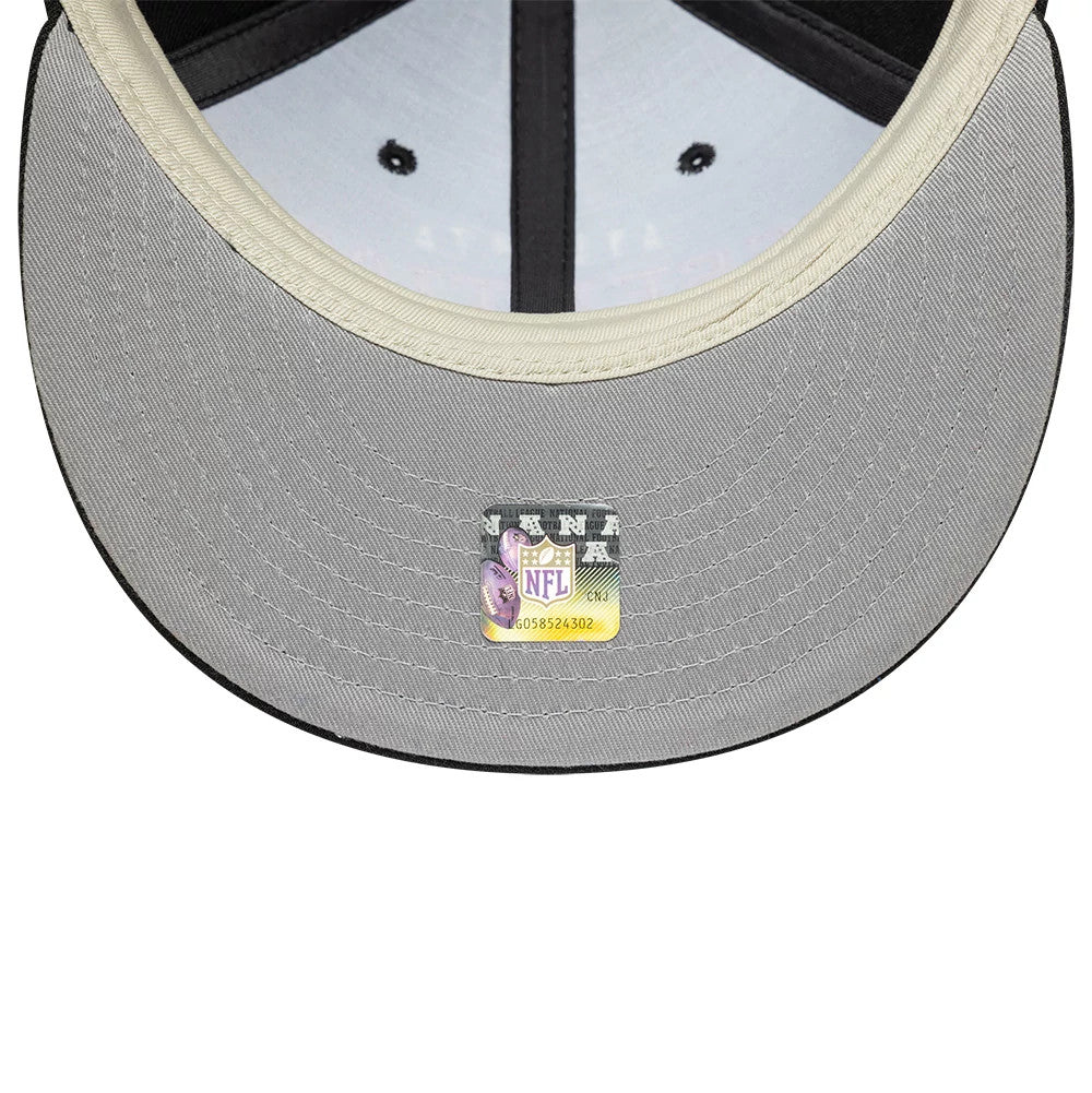 Atlanta Falcons Fear Of God x NFL Black Retro Crown New Era 9FIFTY Adjustable Cap, inside view showing a grey undervisor with a detailed NFL shield sticker and black taping crossing the cap's interior panels.