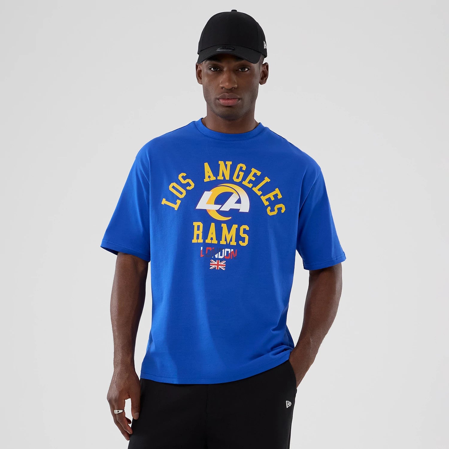 The Male model is wearing LA Rams NFL International Series Games 2025 Bright Blue Oversized T-Shirt 1
