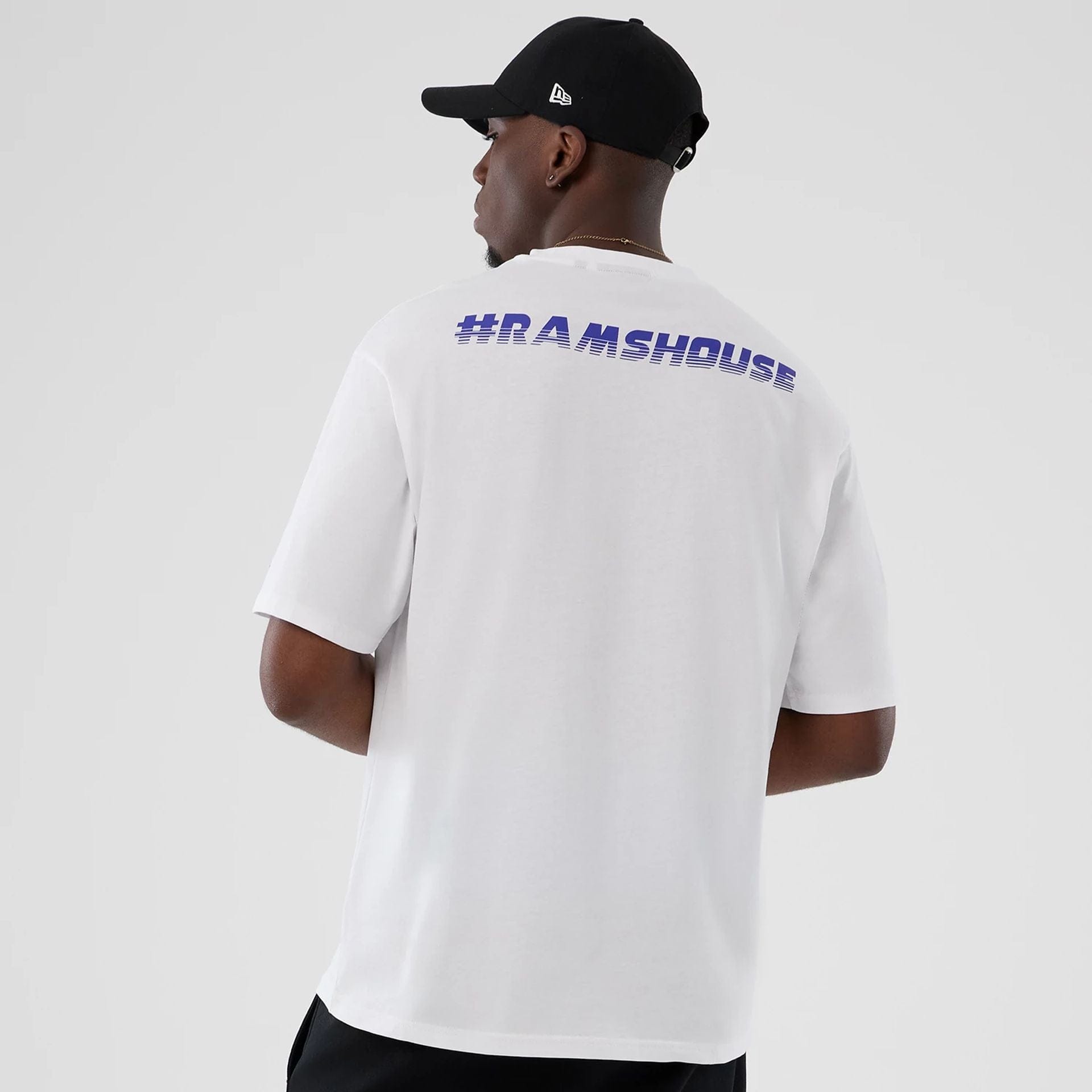 The Male model is wearing LA Rams NFL International Series Games 2025 White Oversized T-Shirt 2