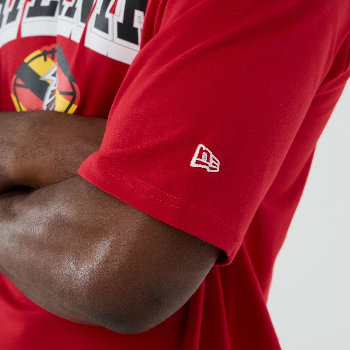 The Male model is wearing Atlanta Falcons NFL International Series Games 2025 Red Oversized T-Shirt 7