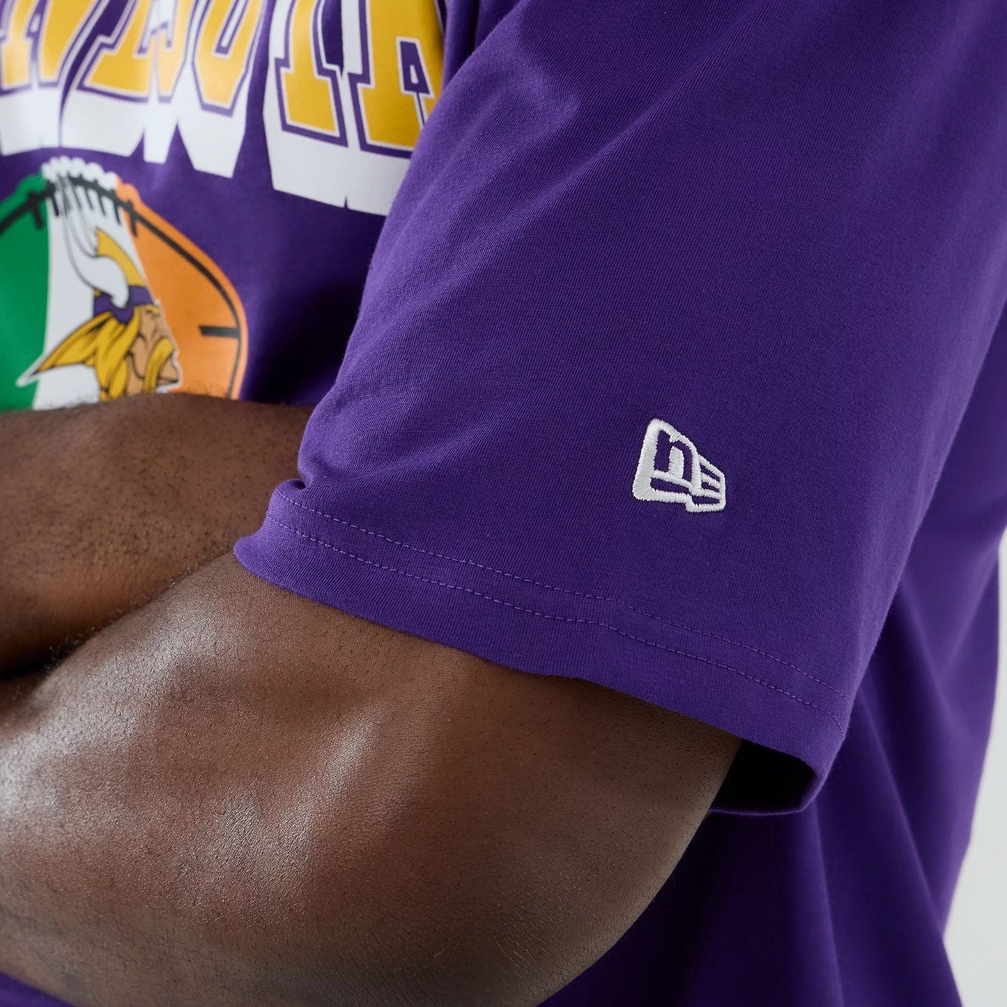 The Male model is wearing Minnesota Vikings NFL International Series Games 2025 Purple Oversized T-Shirt 7