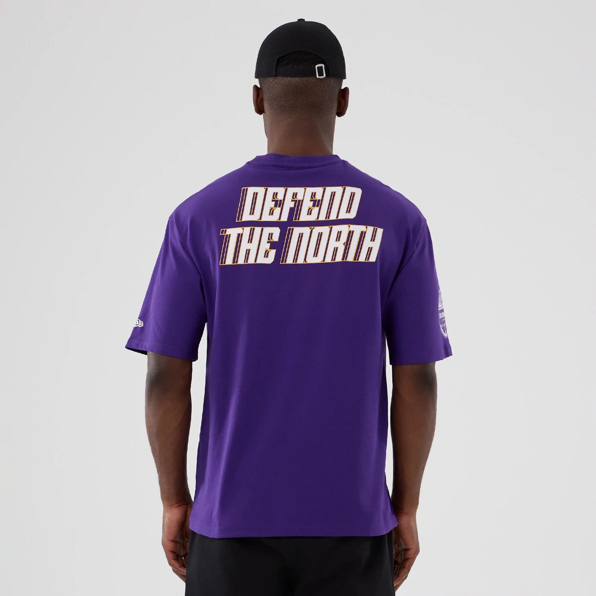 The Male model is wearing Minnesota Vikings NFL International Series Games 2025 Purple Oversized T-Shirt 2