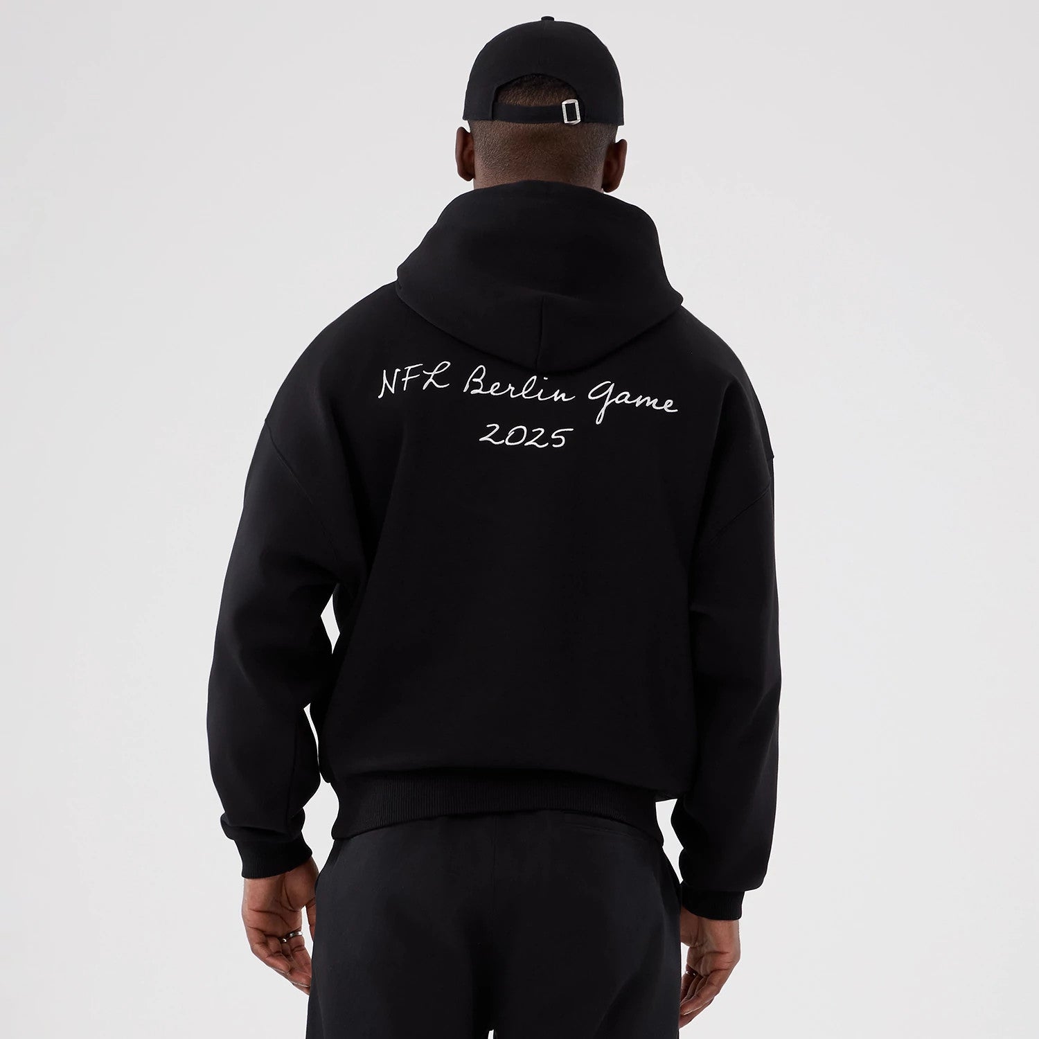 The Male model is wearing Atlanta Falcons NFL International Series Games 2025 Black Premium Pullover Hoodie 2