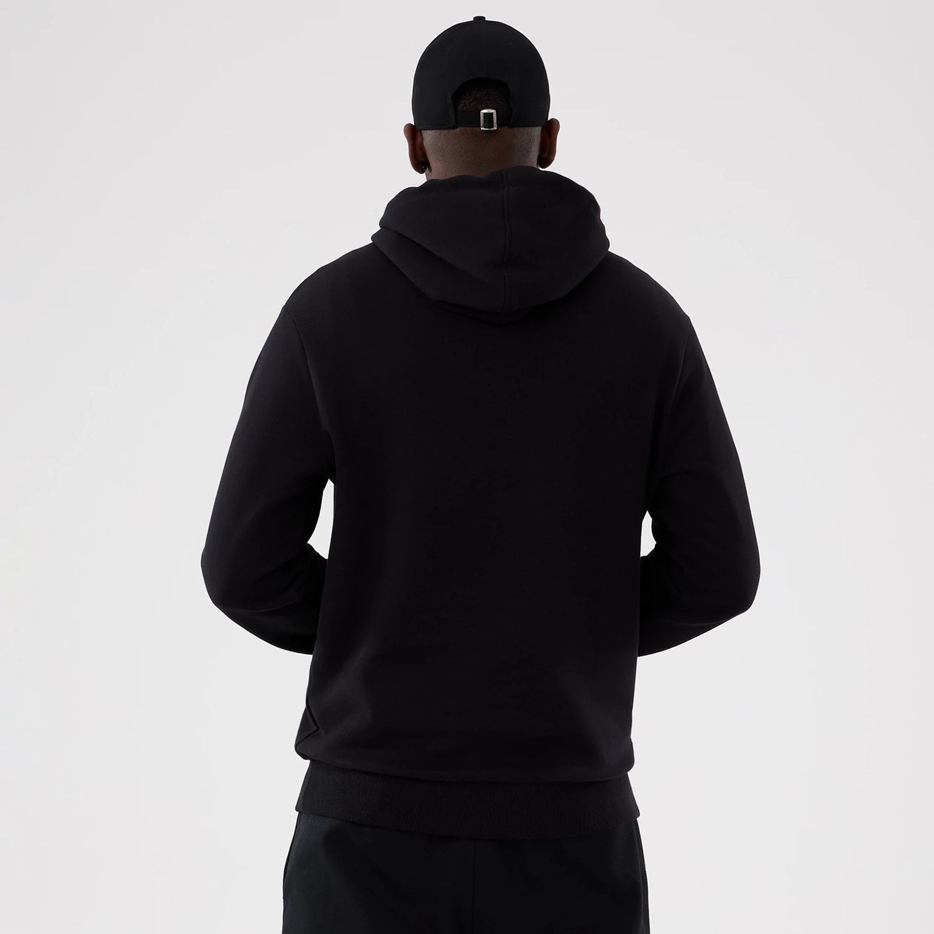 The Male model is wearing Washington Commanders NFL International Series Games 2025 Black Pullover Hoodie 2