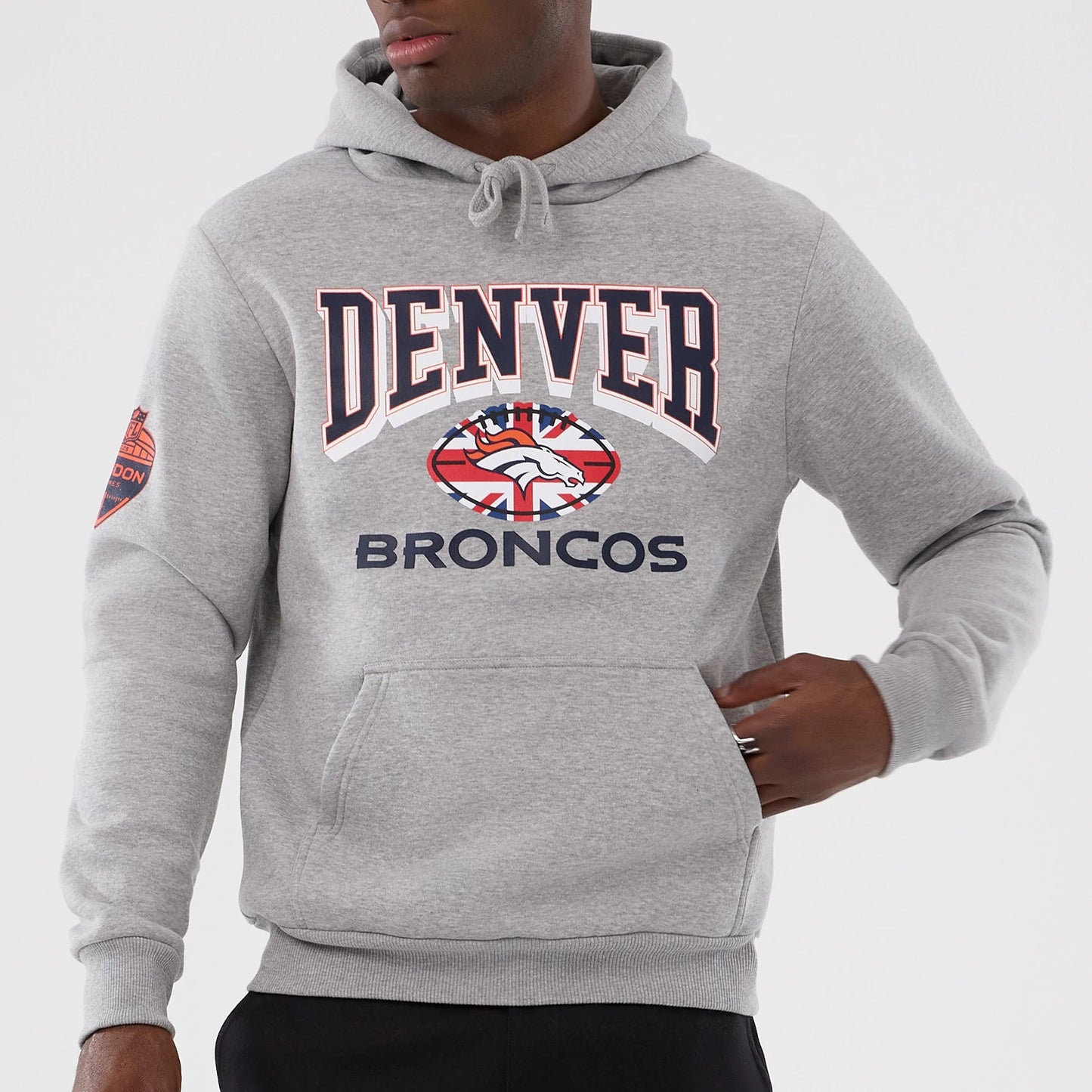 The Male model is wearing Denver Broncos NFL International Series Games 2025 Grey Pullover Hoodie 7