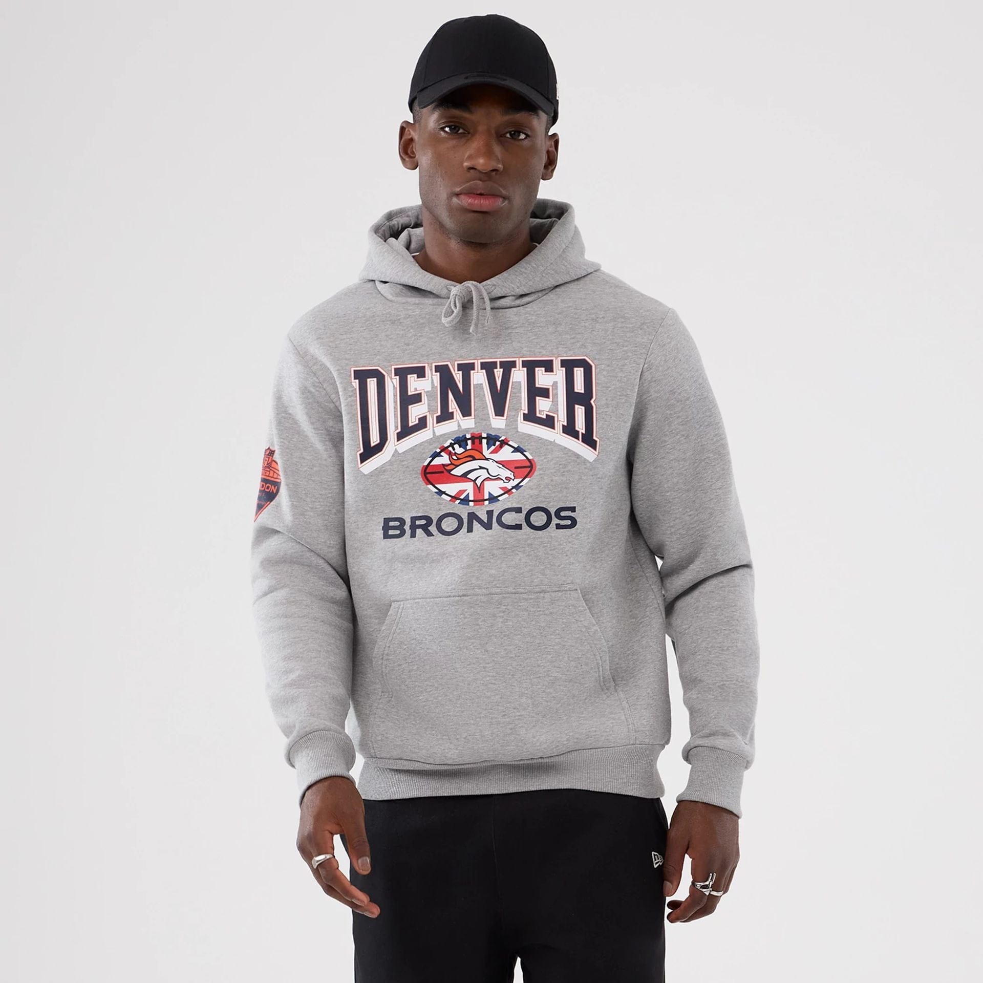 The Male model is wearing Denver Broncos NFL International Series Games 2025 Grey Pullover Hoodie 1