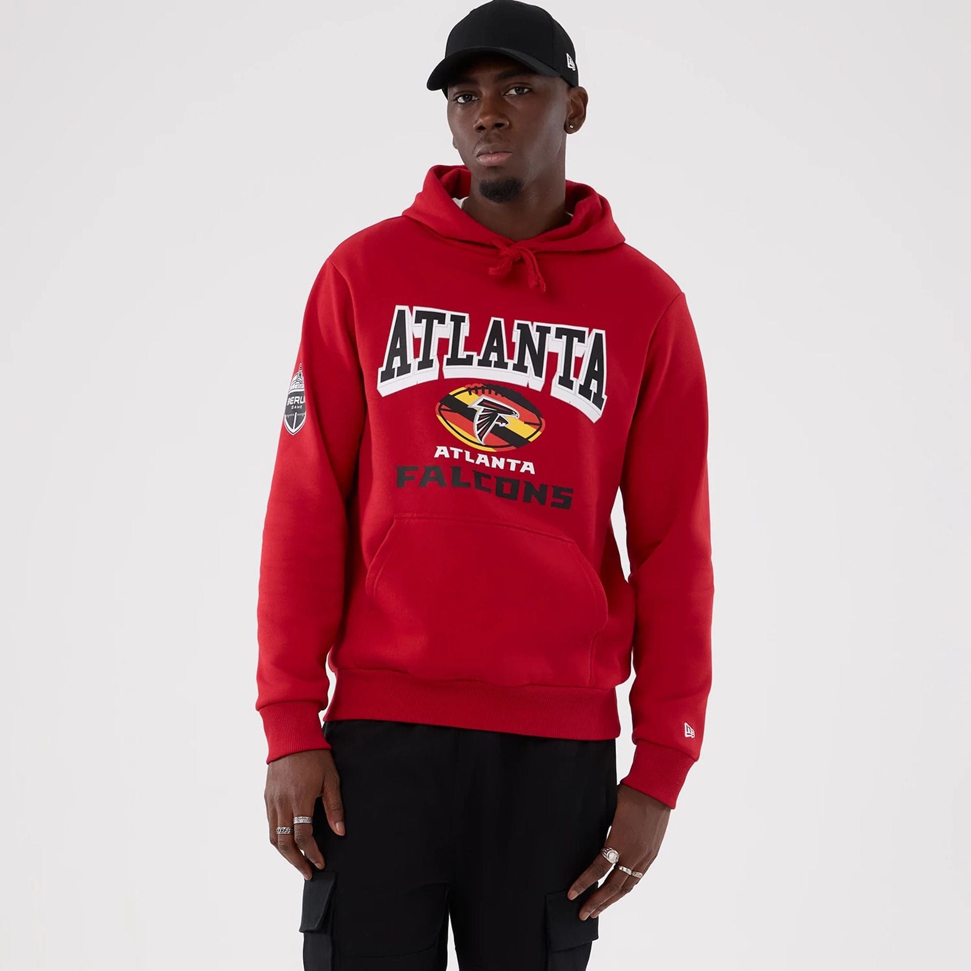 The Male model is wearing Atlanta Falcons NFL International Series Games 2025 Red Pullover Hoodie 1