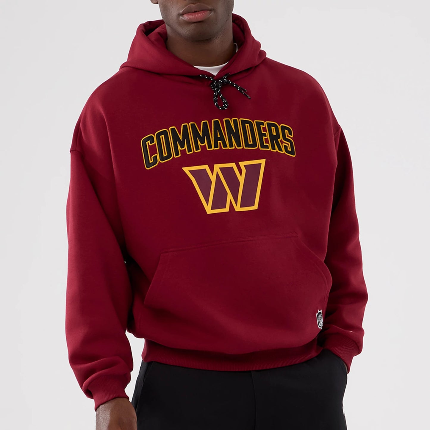 The Male model is wearing Washington Commanders NFL International Series Games 2025 Dark Red Premium Pullover Hoodie 7